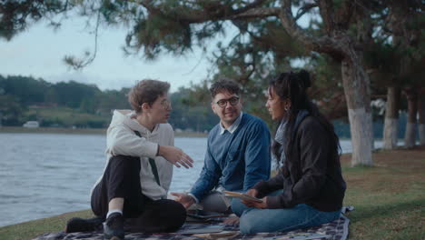 students sitting in the park and discussing homework