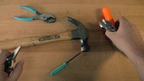 top-down view of tools on tabletop grabbed all at once