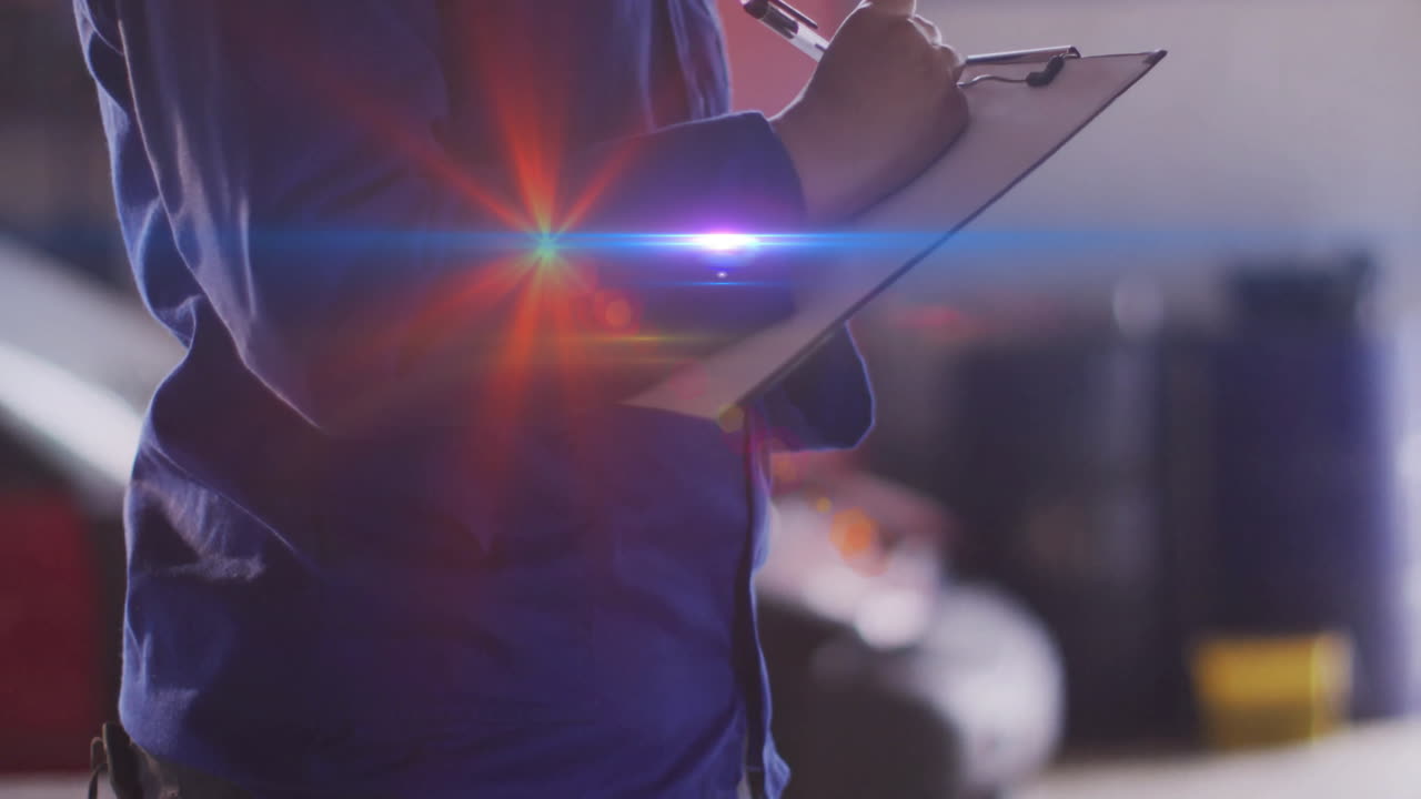 female technician writing notes in garage, with light leaks and floating data charts overlay