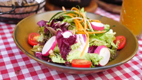 fresh salad with tomatoes, radish, and lettuce