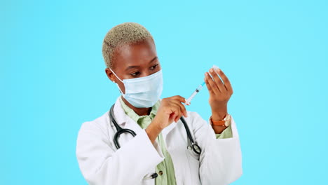 Covid,-vaccine-and-a-doctor-black-woman-on-a-blue