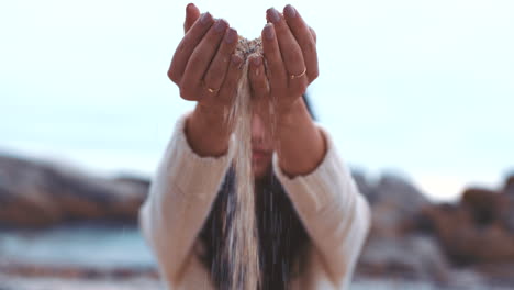 Woman,-hands-and-beach-sand-grain-in-air-falling