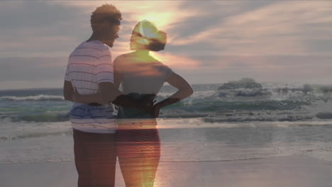 couple embracing at shoreline watching sunset, featuring animated travel map and heart icons