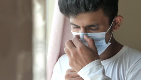 man adjusting face mask