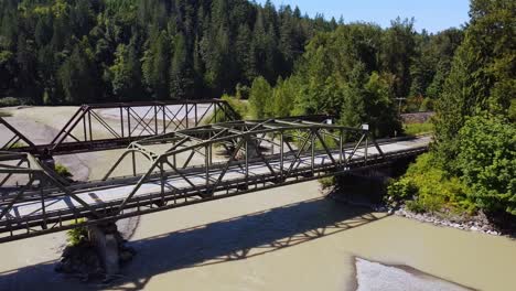 drone panning across the nooksack river bridges in the north cascades, washington state