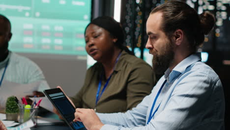 team of business associates examining infographics and legal data