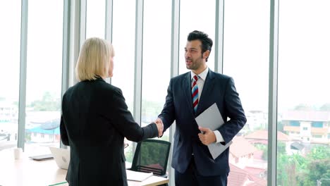 business people handshake with friend at office