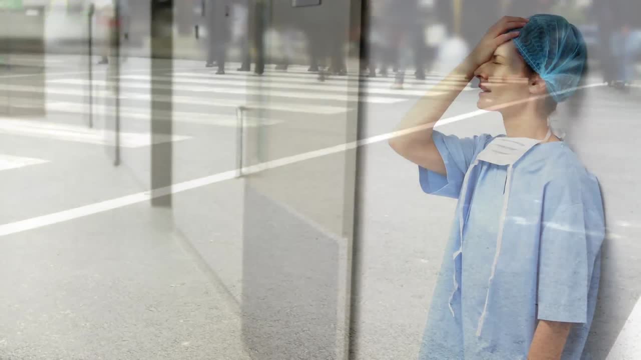 Animation of a doctor standing in a hospital hallway over people crossing the street.