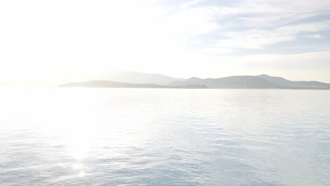 shot of a woman looking at the sea on a sunny day