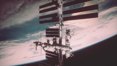 international space station rotates solar panels in outer space