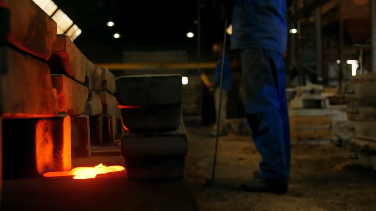 Male worker standing near mould in workshop 4k