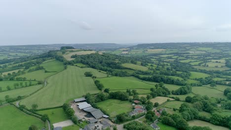 Stunning-aerial-looking-across-East-Devon-and-the-Blackdown-Hills,-part-of-the-English-countryside
