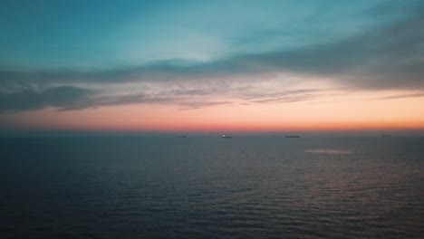 drone view flying over the ligurian sea off the coast of cinque terre riveria, italy at twilight in 4k