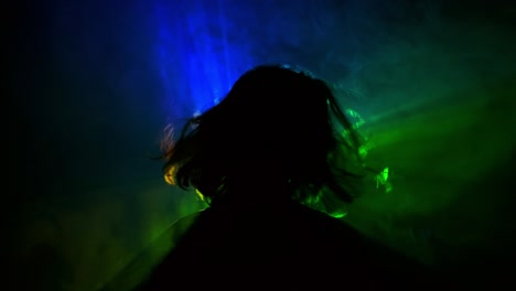 profile of the girl's head seems to be in triangle of colored rays. girl moves by changing the location of the smoke that fill the triangle.