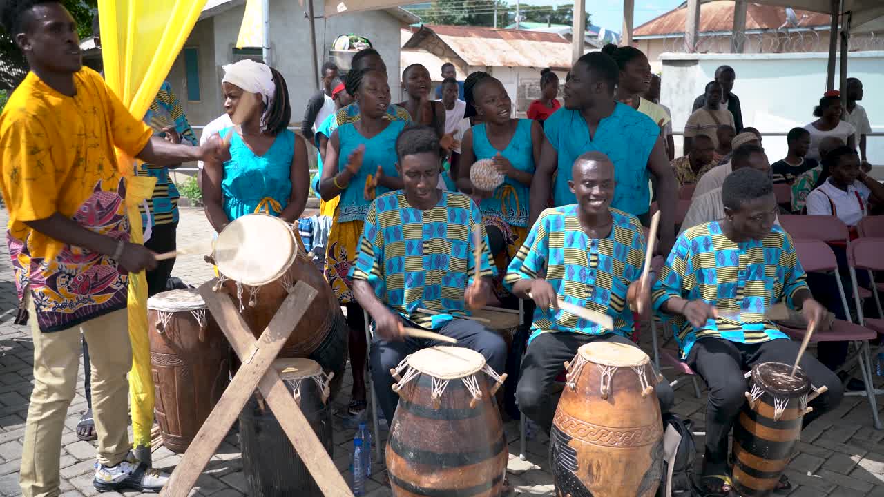 A music group of drummers and singers perform for the annual Yam Festival in Ho, Ghana, West Africa.