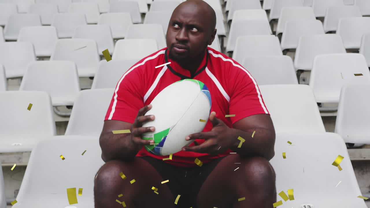 Animação de confete dourado caindo sobre um jogador de rugby masculino afro-americano sentado
