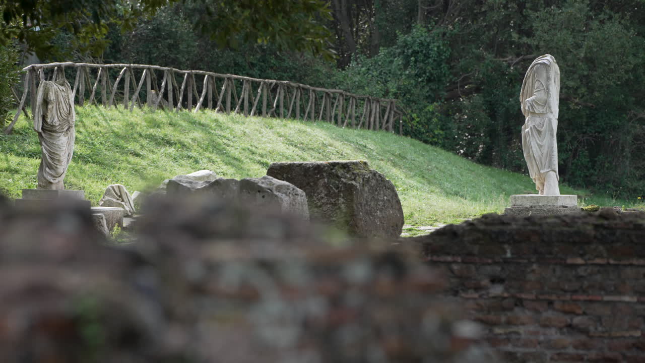 Headless stone statues of males togas at the ancient Roman site of Ostia Antica