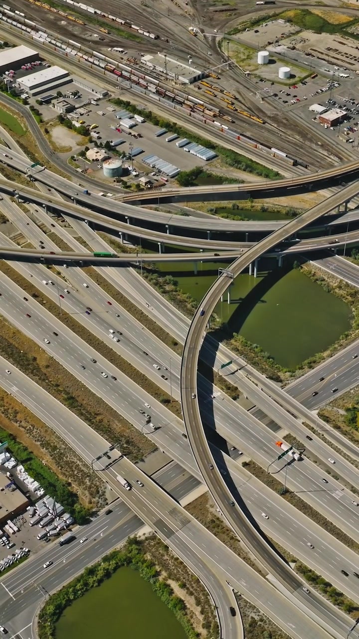 Traffic crossing on complex highway with downtown cityscape