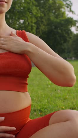 pregnant woman practicing yoga outdoors