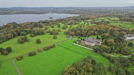 aerial view of muckross house, ireland, amidst lush greenery and lakeside
