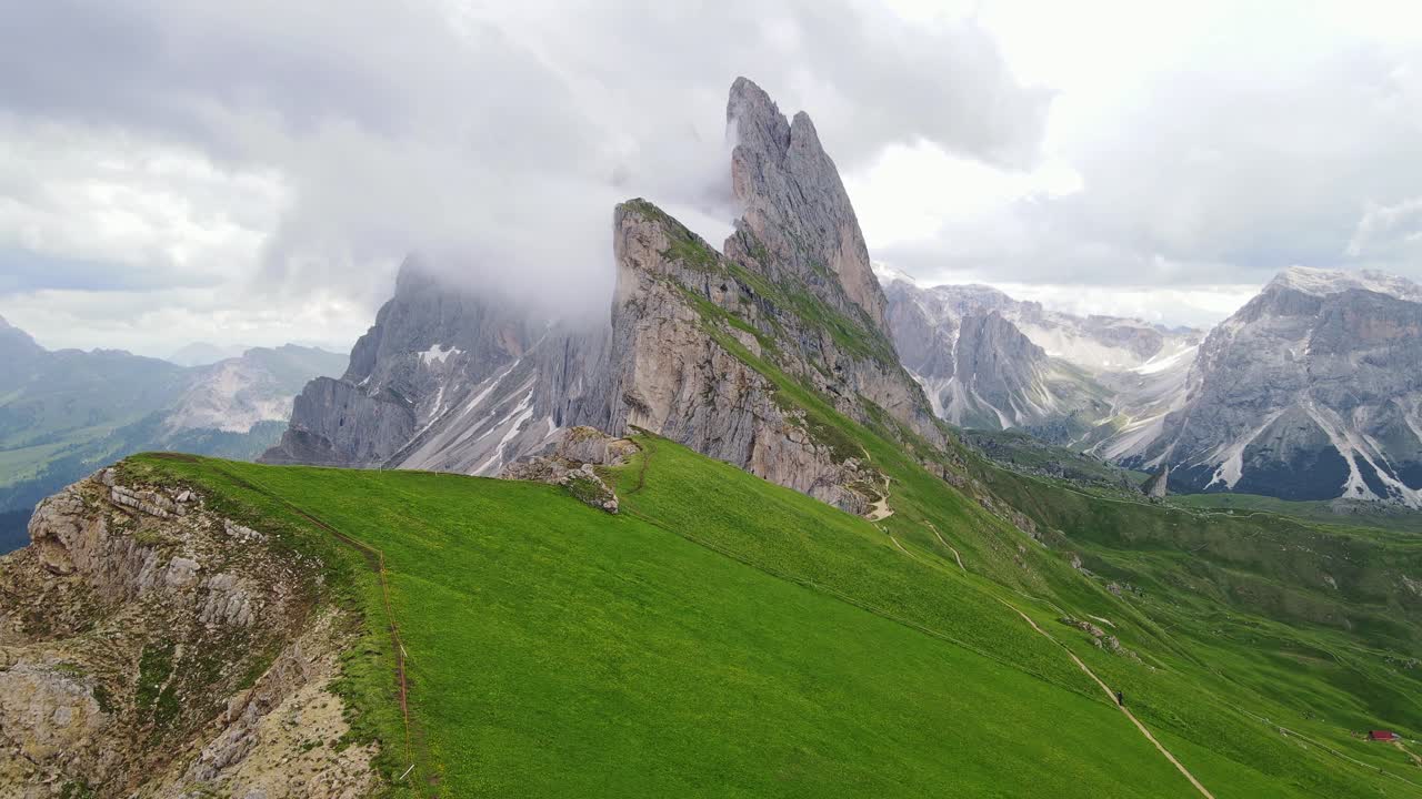 Misty epic contrast unfolds as sun highlights Seceda and Furchetta in Bolzano