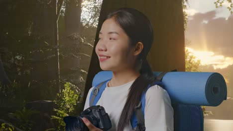 woman hiking in forest with camera