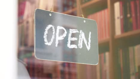 open sign on a bookshop door