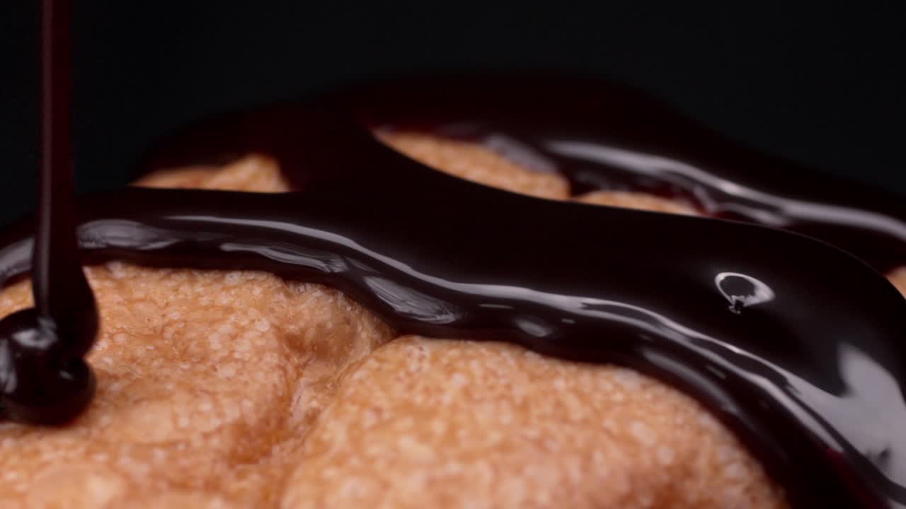 Melting chocolate drizzle, sweet tasty sauce, pastry desserts, slow-mo