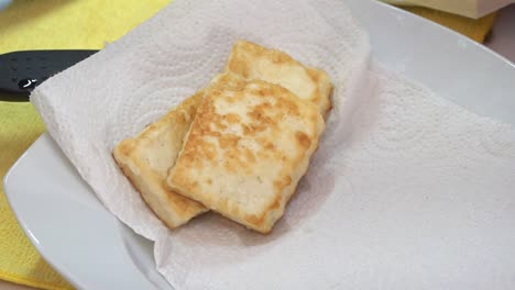 Fried-cheese-placed-on-absorbent-napkin