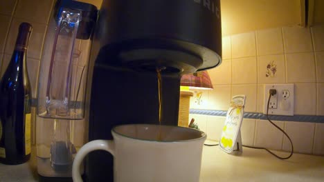 gopro tight but wide shot of coffee pouring from keurig into mug