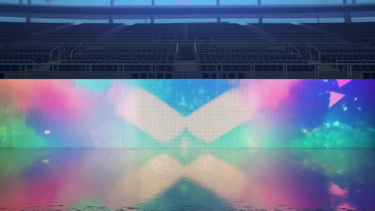 Interno di uno stadio vuoto con gradinate superiori scure, un ampio display LED luminoso e un pavimento lucido riflettente, mentre morbidi motivi astratti di colore si muovono attraverso una foschia arcobaleno, e colonne bianche brillanti.