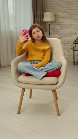 girl taking a selfie with her smartphone