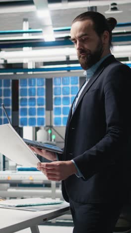 vertical video engineer consultant in formal suit inspecting the industrial operations