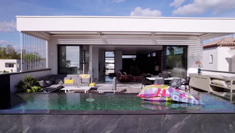 slow pull-out shot revealing a swimming pool on a villa balcony in sete, france