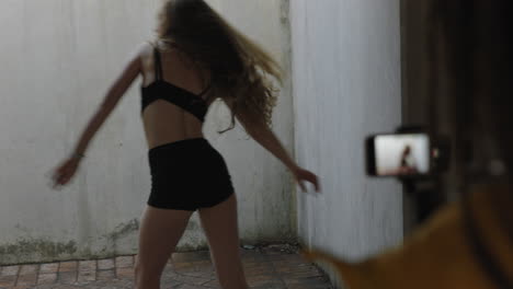 dancing-woman-young-caucasian-freestyle-dancer-performing-for-friend-using-smartphone-taking-video-enjoying-sharing-hip-hop-dance-on-social-media