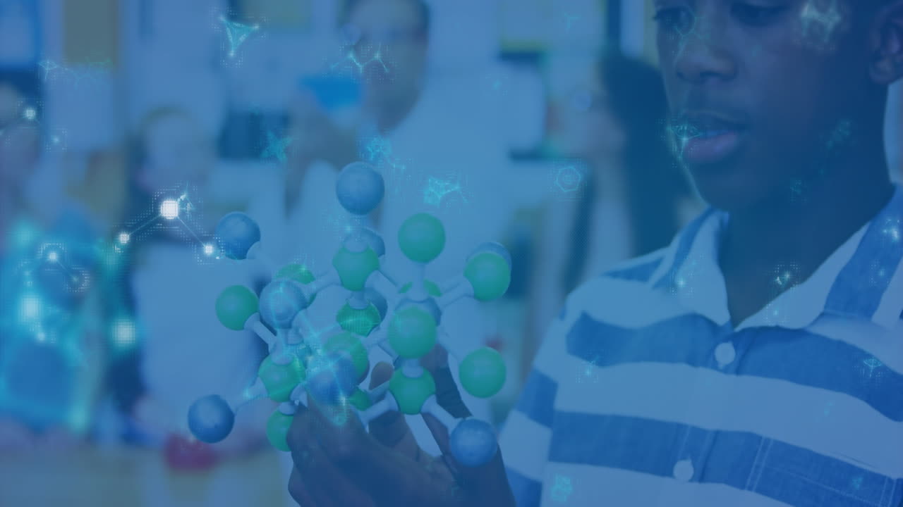 Young person examining molecular model with scientific data animation overlay