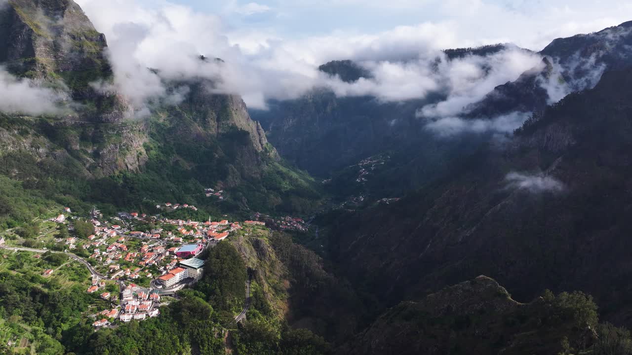 Scenic parish Curral das Freiras in deep valley with dramatic landscape, aerial