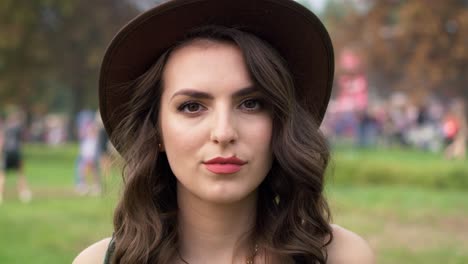 Close-up-of-caucasian-woman-looking-at-camera-at-music-festival.