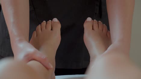 therapist performing foot massage - close up