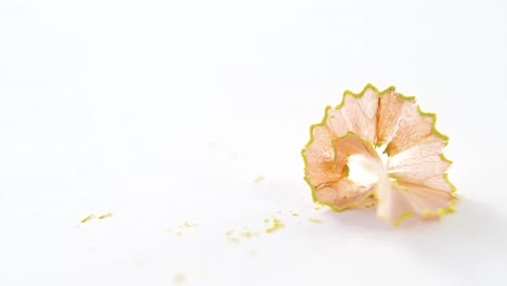 yellow color pencil shavings on a white background