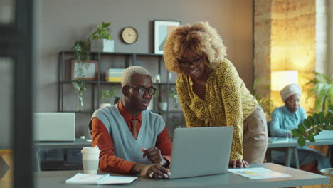 african american man and woman working together in office