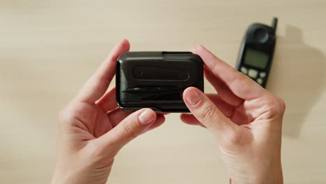 vintage pager in hands