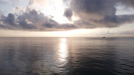 a-fishing-boat-gliding-on-the-sea-in-the-morning-sun