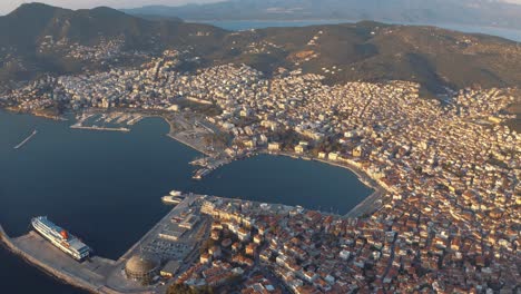 aerial  drone pan down view over port of lesbos in mytilene city, greece