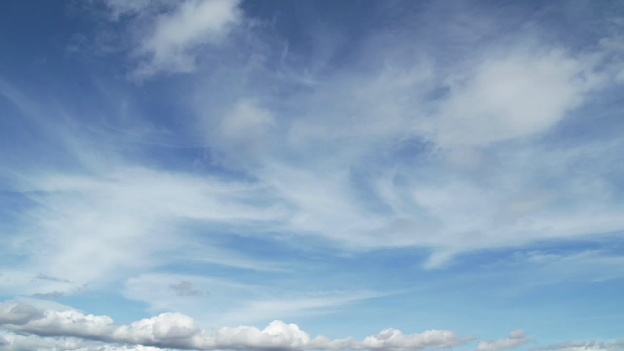 In this captivating drone timelapse, clouds roll and shift across the vast sky, creating an ethereal dance of clouds and motion.