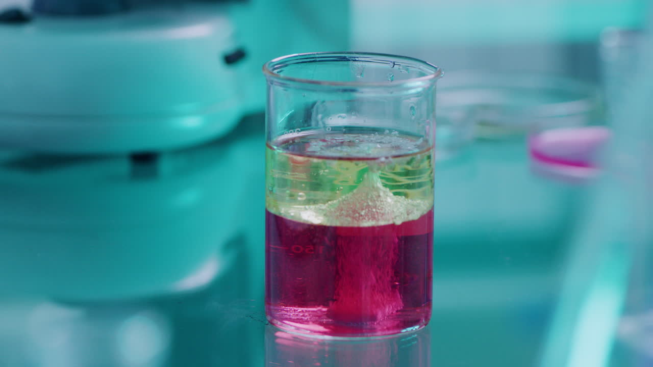 Test tube with bright toxic liquid foaming under