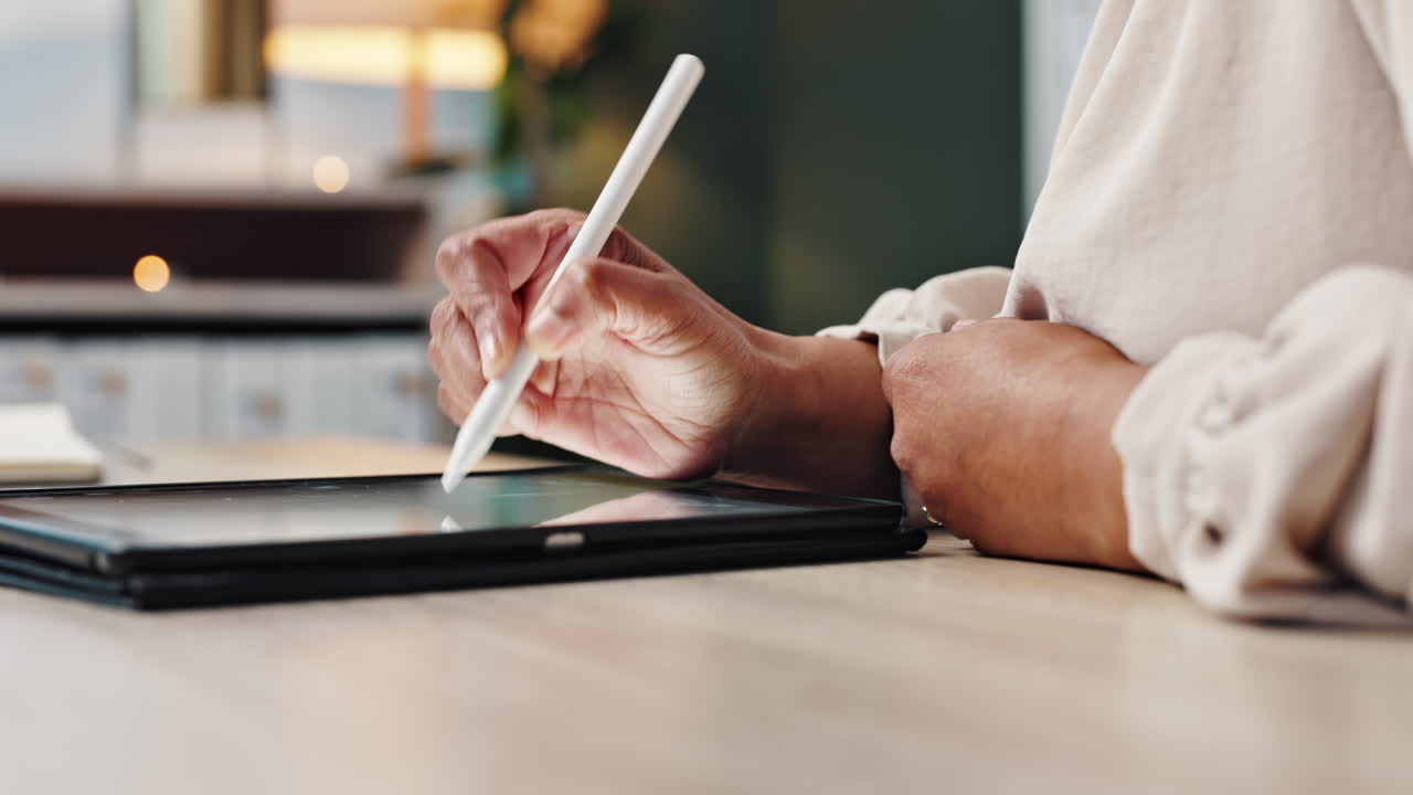 Woman using stylus on tablet