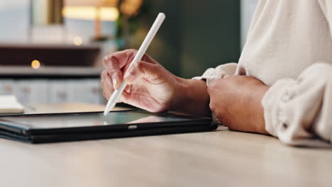 woman using stylus on tablet