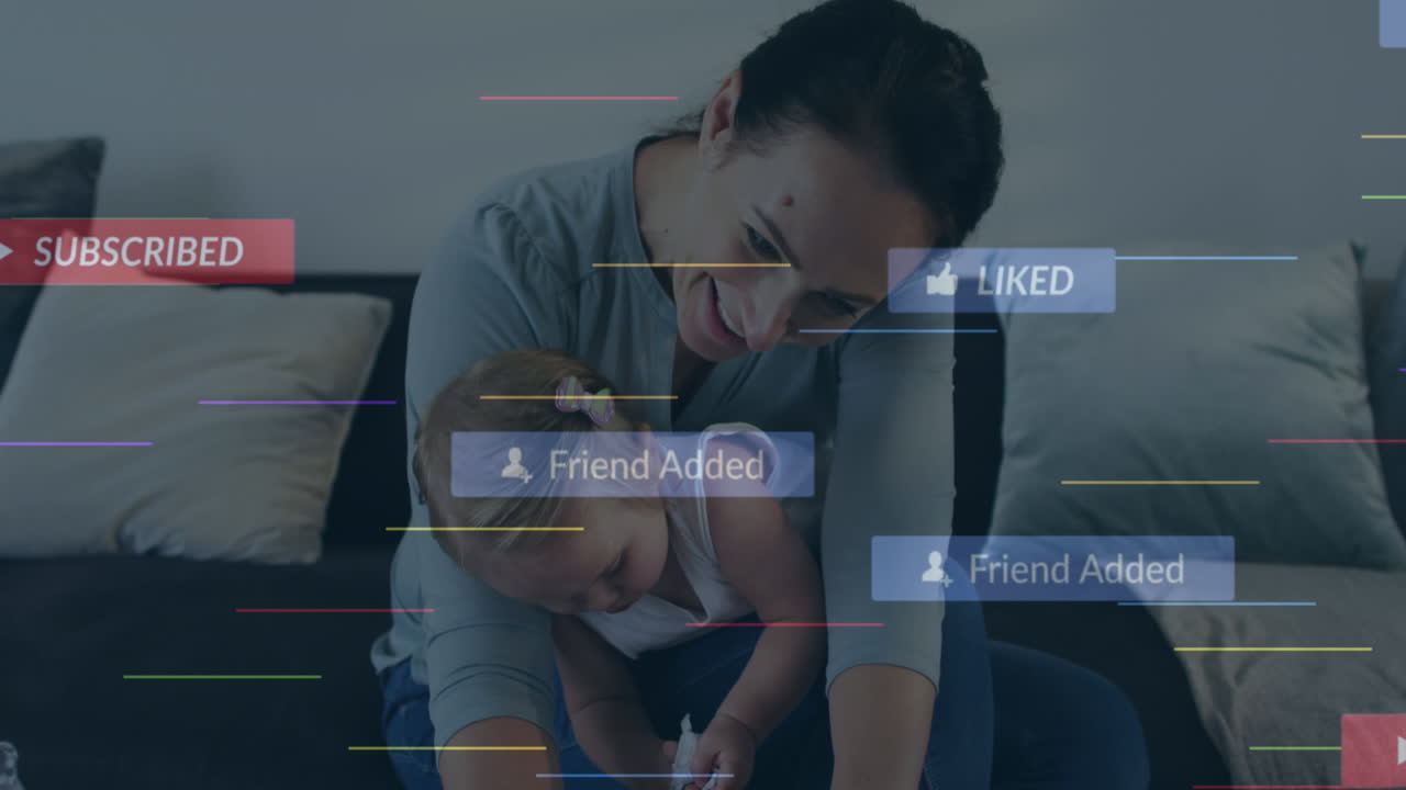 animación de iconos de redes sociales sobre mujer caucásica con bebé usando portátil en casa.