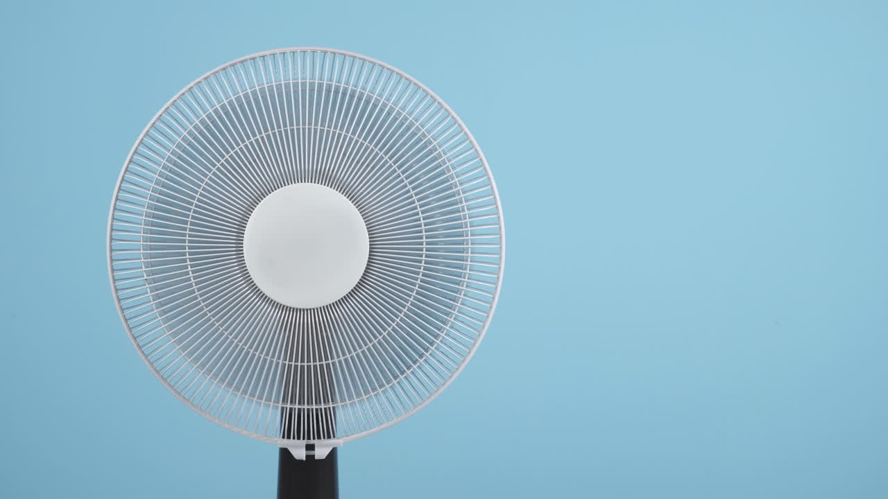 Electric Fan Against Blue Background